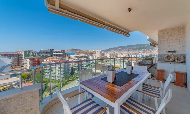 down-floor balcony with table and chairs