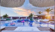 outdoor pool, sitting area, and sunbeds