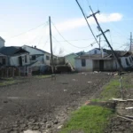 Illustrative flood damage affecting a residential street and nearby homes