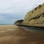 Exposed coastal soil and rock slope used to illustrate landslide-risk checks