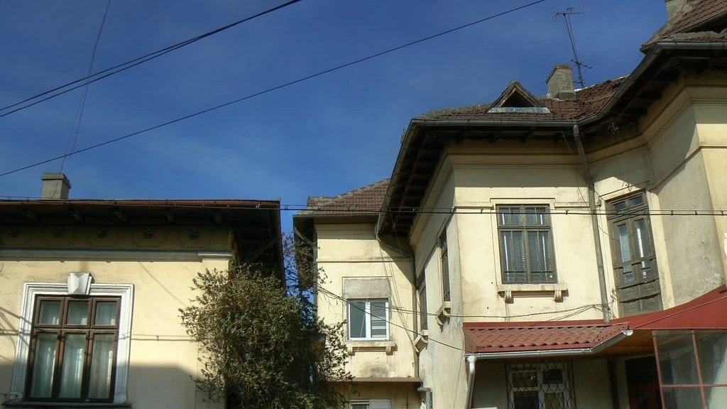Older residential building exterior illustrating where an asbestos survey may be relevant