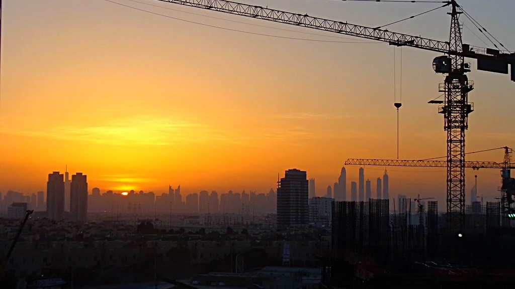 Dubai skyline and construction cranes illustrating an off-plan Oqood registration